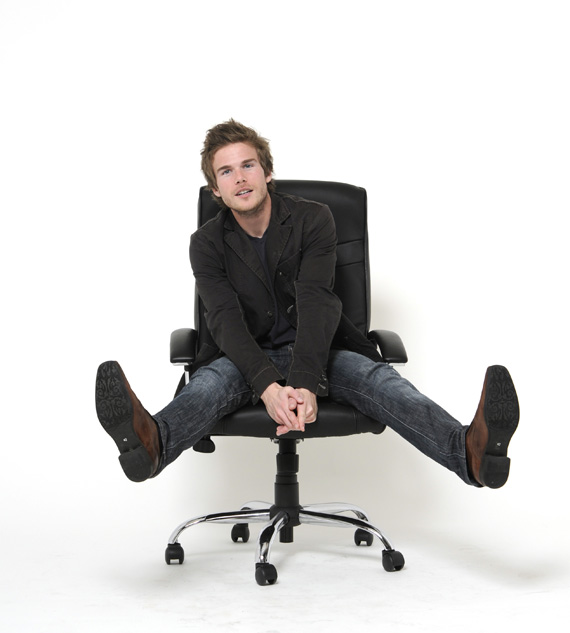 Entrepreneur Colin Wright sitting in an office chair Entrepreneur Colin Wright sitting in an office chair