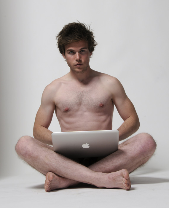 Self improvement enthusiast Colin Wright naked and working on his Macbook Pro Self improvement enthusiast Colin Wright naked and working on his Macbook Pro
