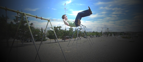 Colin Wright on a swing