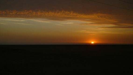 Dark orange sunset in the Peruvian desert