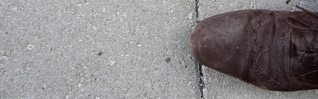 Wingtips on sidewalk